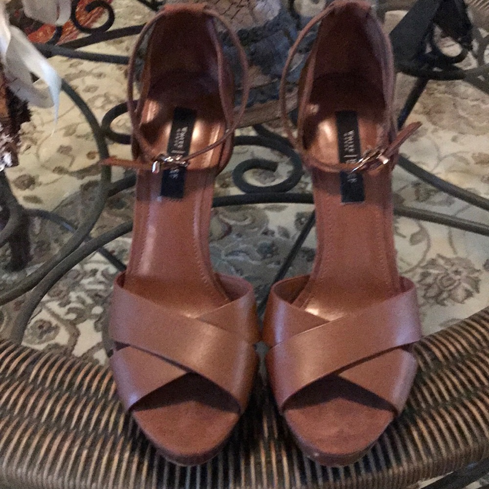 Brown strappy heels.